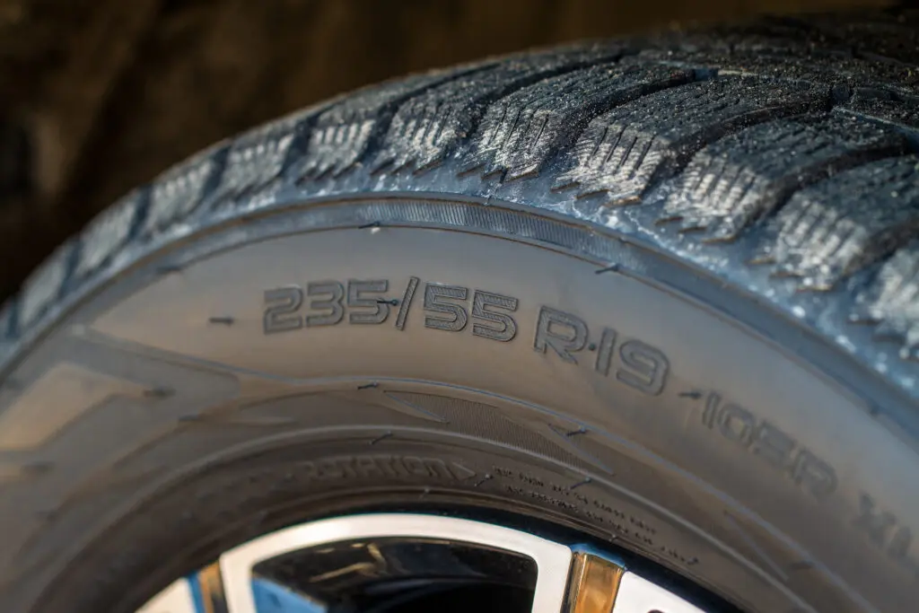 Close-up of worn tire tread. 