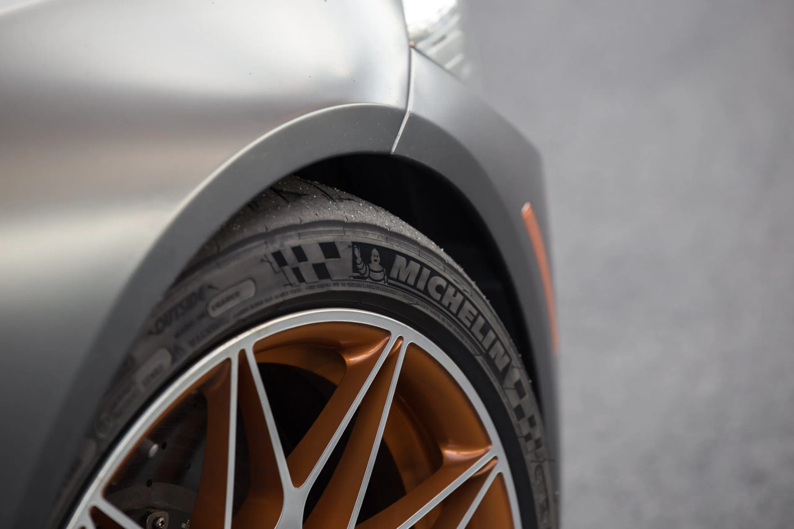 IMG_6430 A closeup photograph of a nondescript Michelin tire on a car