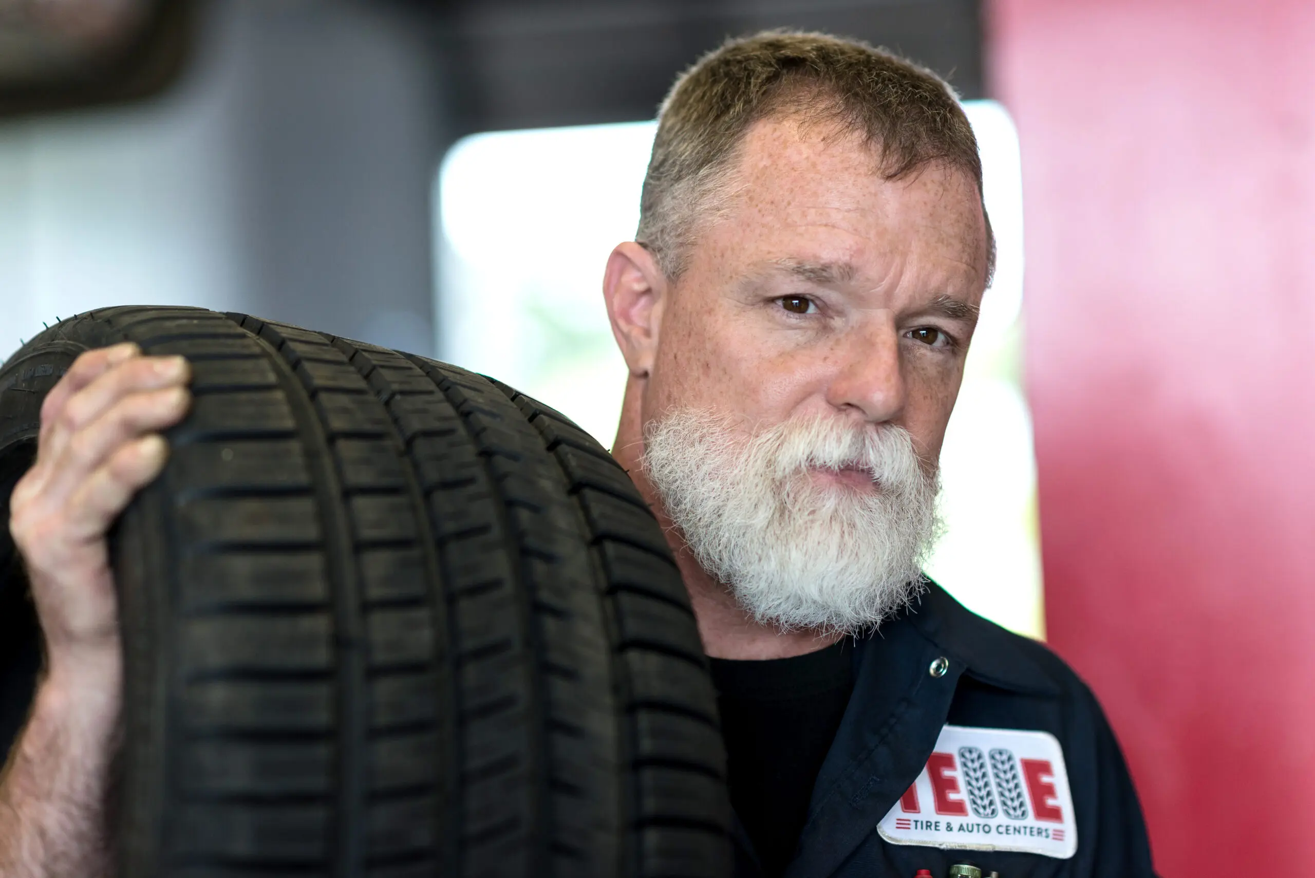 Telle Tire mechanic with tire