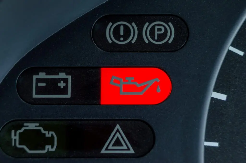 Oil lamp warning light illuminated in car dashboard