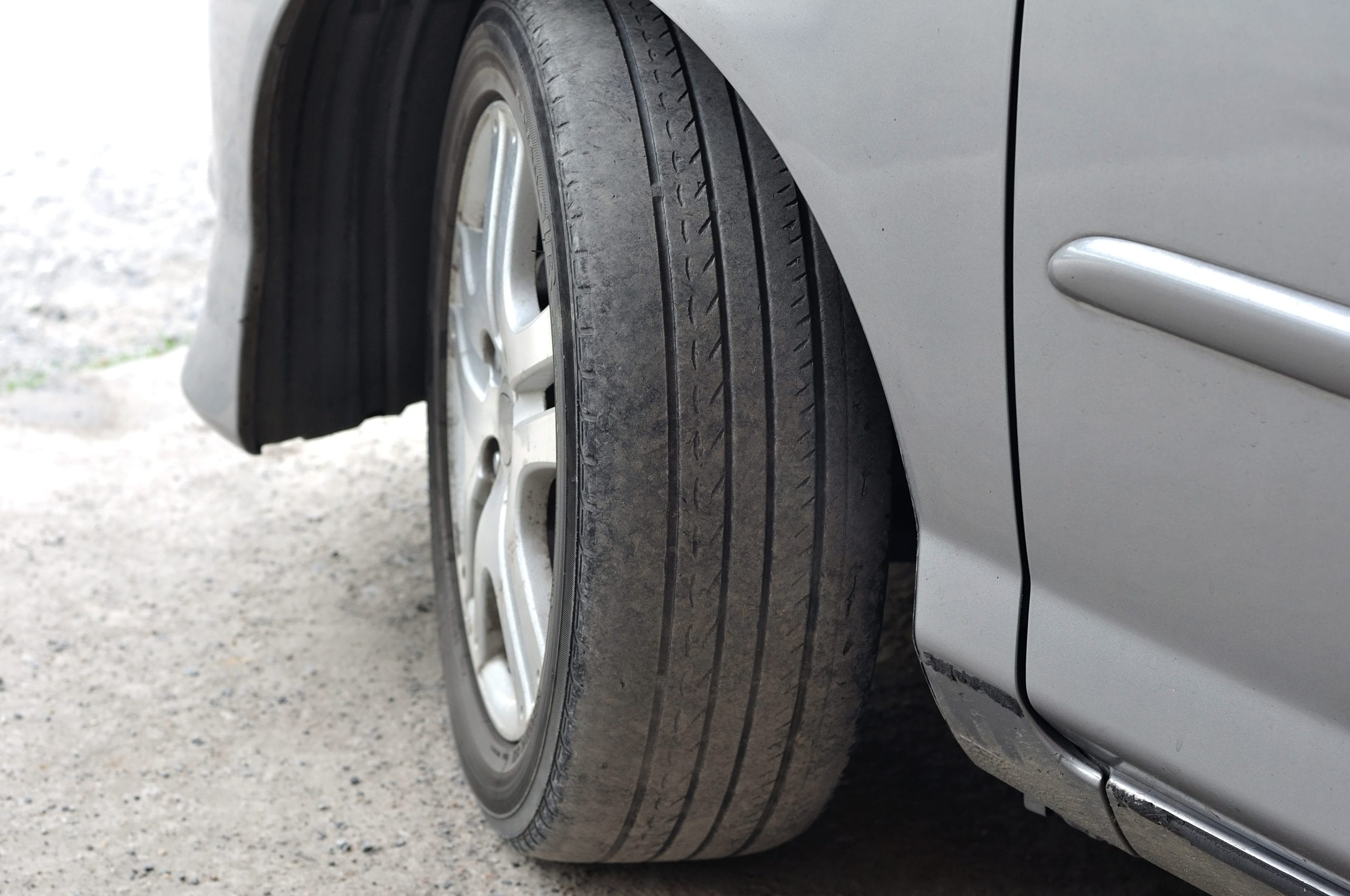 A closeup view of a worn, ready to be replaced tire.