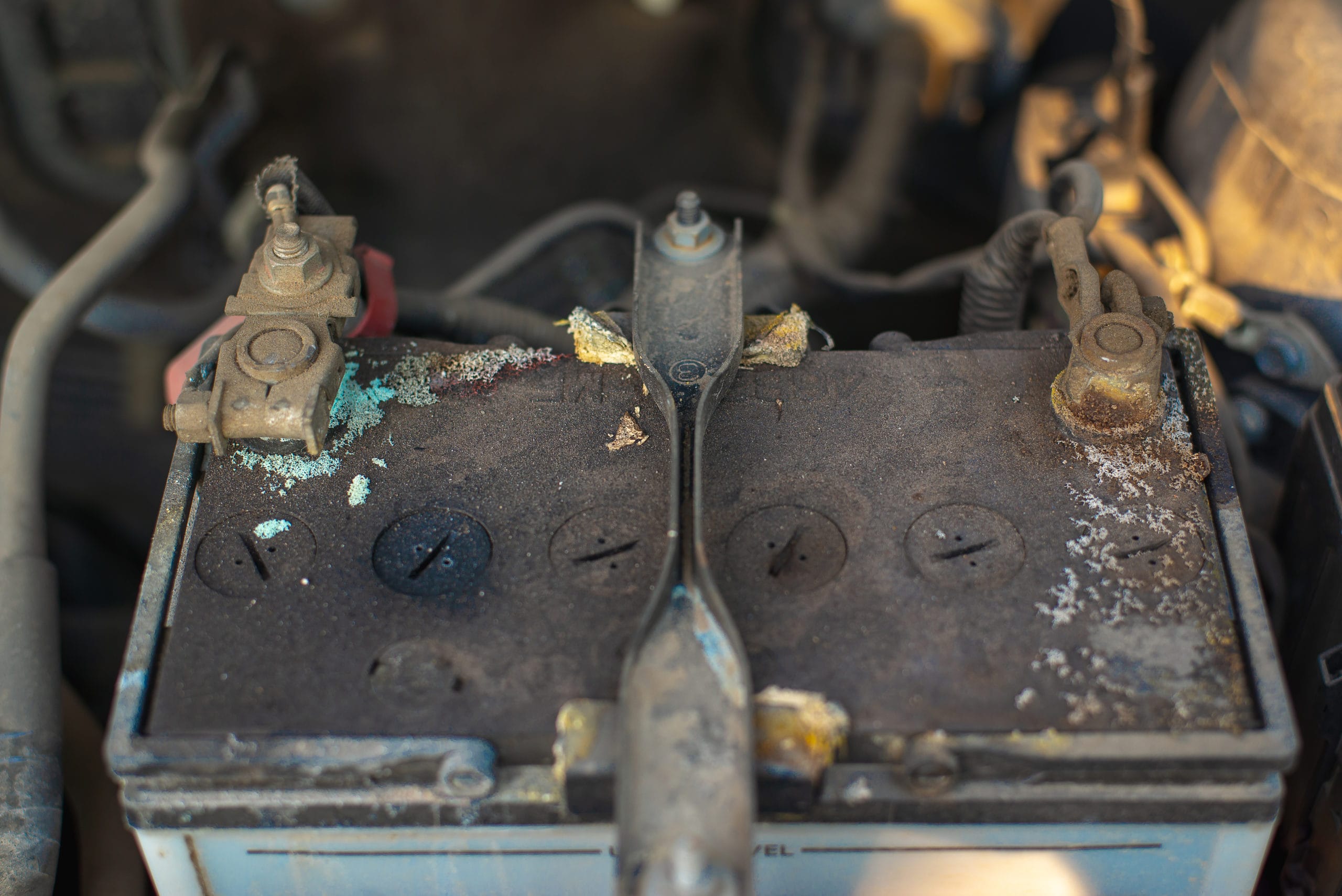 A corroded car battery in need of cleaning