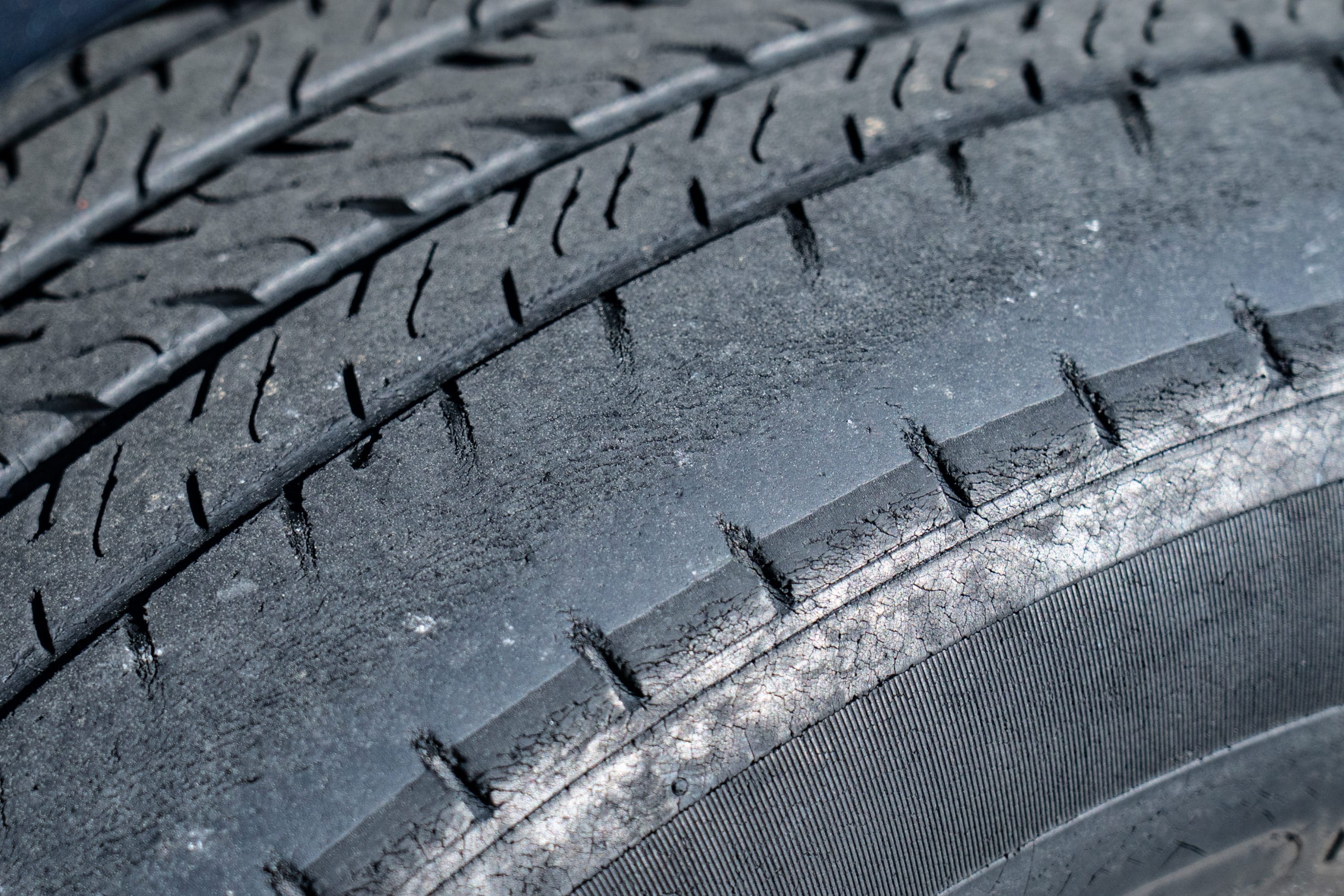 closeup of a dangerously worn tire tread