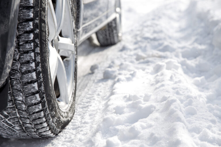 Close-up of tire on snowy road.
