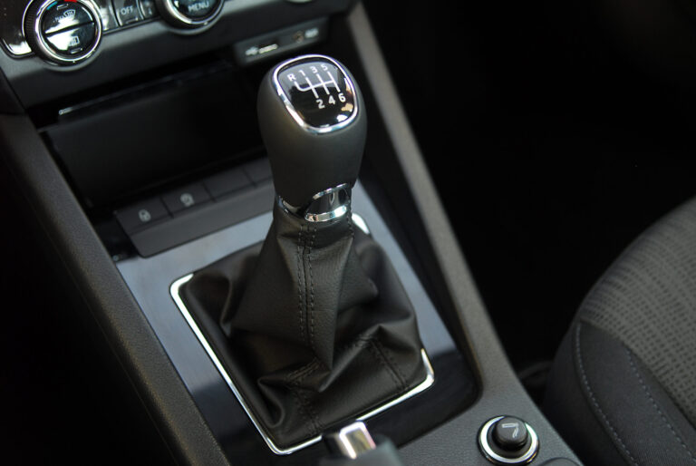 Close-up of stick shift in car.