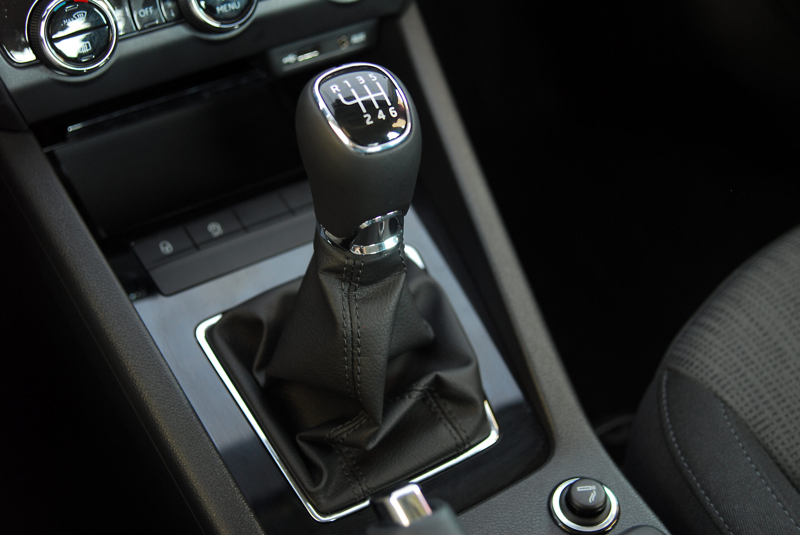Close-up of stick shift in car.