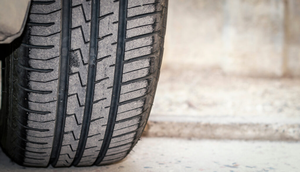 Close-up of worn tire. 