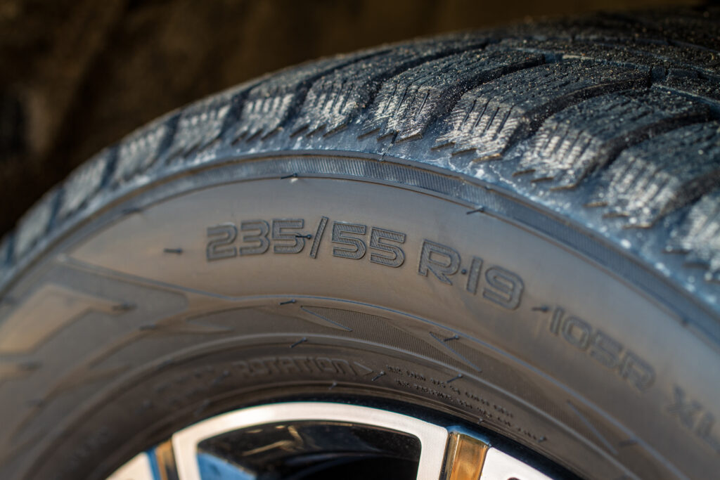 Close-up of worn tire tread. 