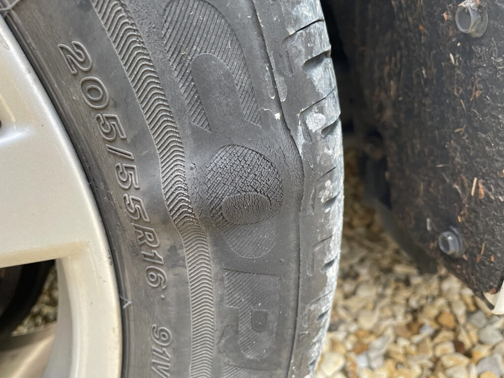 car tire with sidewall bulge