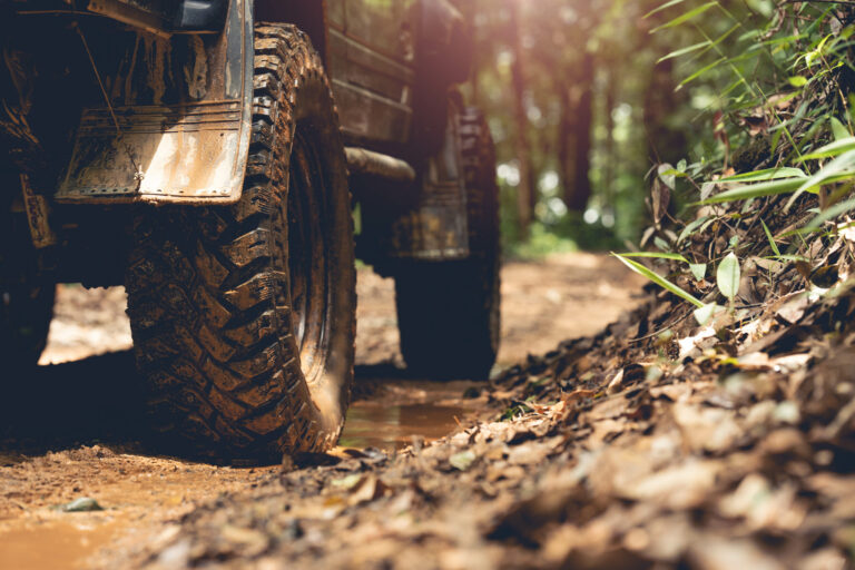 Close-up of dirty off-road tires.