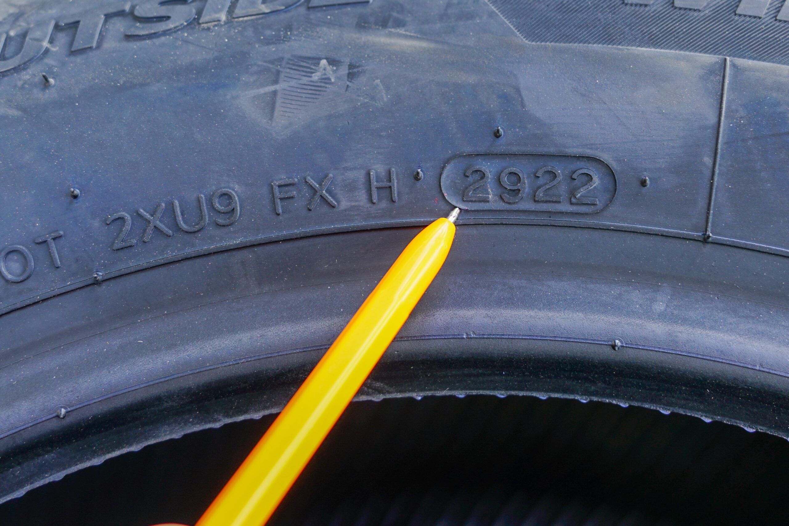 Side view of new tire with designation of week and year of tire production