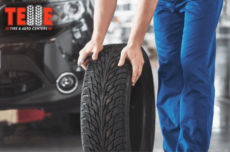 Technician inspecting tire tread affected by Missouri road conditions and tire wear