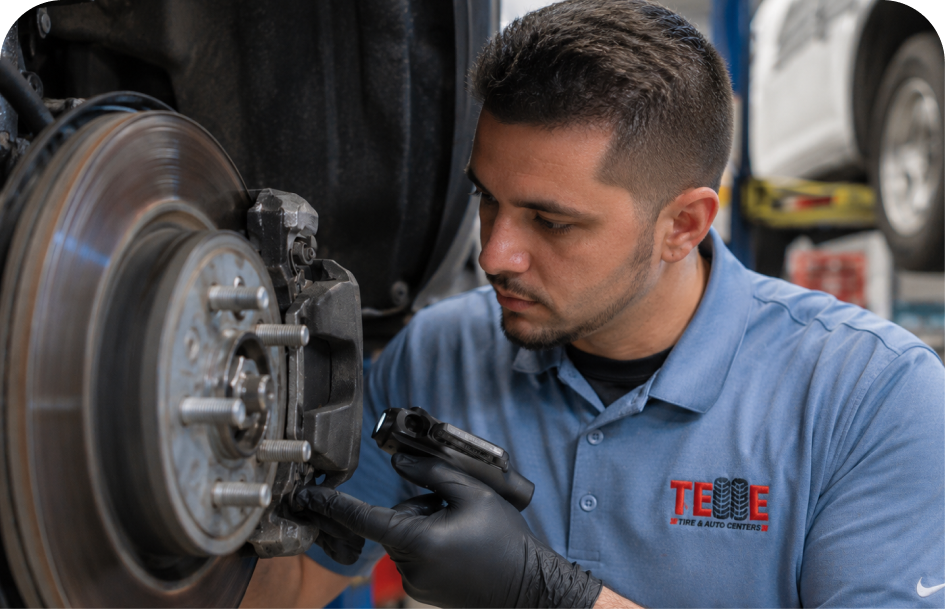 A technician carefully inspecting a brake