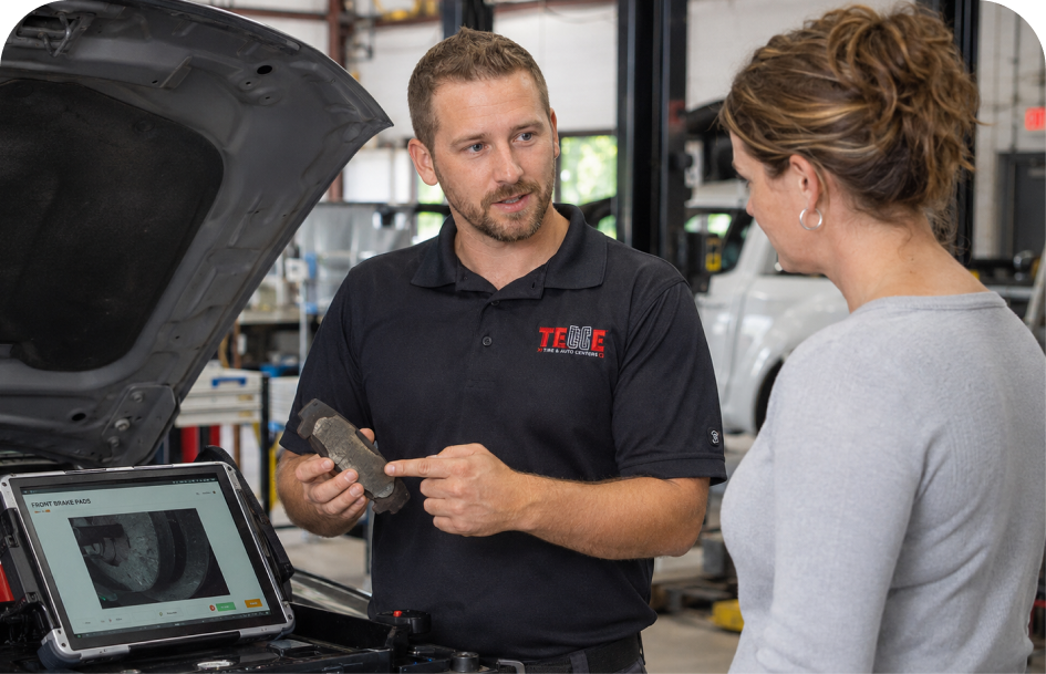 A Telle team member explaining a repair